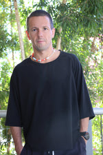 Black oversize t-shirt. Sleeves are a little lower an elbow